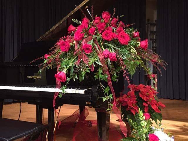A Schafer & Sons grand piano adorned with roses — a tribute to Vern Schafer